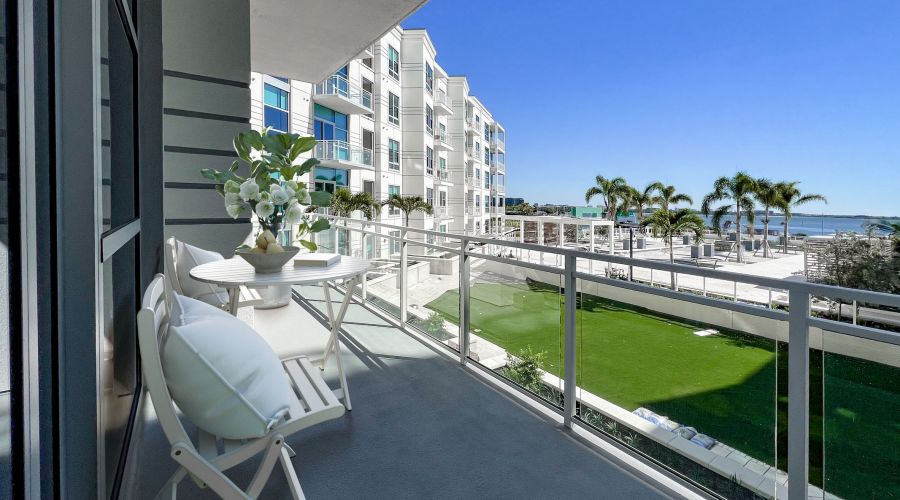 Spacious patio with furniture overlooking an outdoor courtyard at The Emerson On Rocky Point