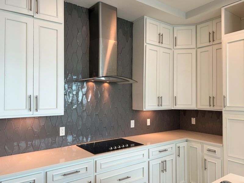 Hood range over gas stove at The Emerson On Rocky Point